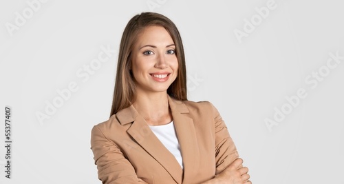 Young happy woman posing on background