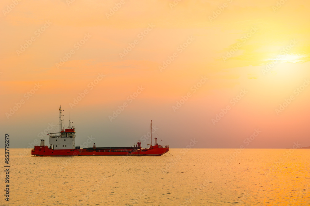 Transport cargo boat ship with sunset sea ocean shipping for import export industry scene view