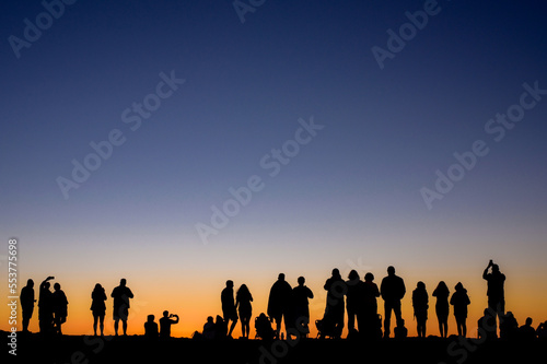 Group of people at sunset