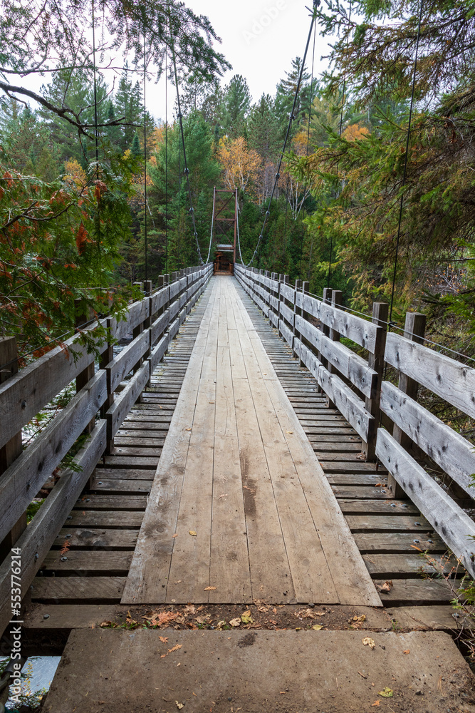 Wooden bridge at Ouareau forest. Quebec. Canada.