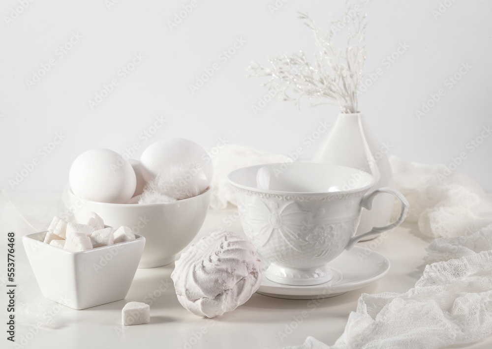 White still life with white dishes, eggs, sugar and marshmallows White still life with white dishes, eggs, sugar and marshmallows