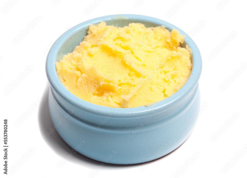 Ghee in a butter dish isolate on a white background Ghee in a butter dish isolate on a white background