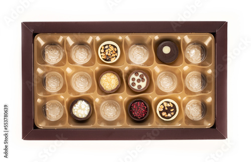 Chocolate temptation with a variety of delicious chocolate candies in a box. Top view.
