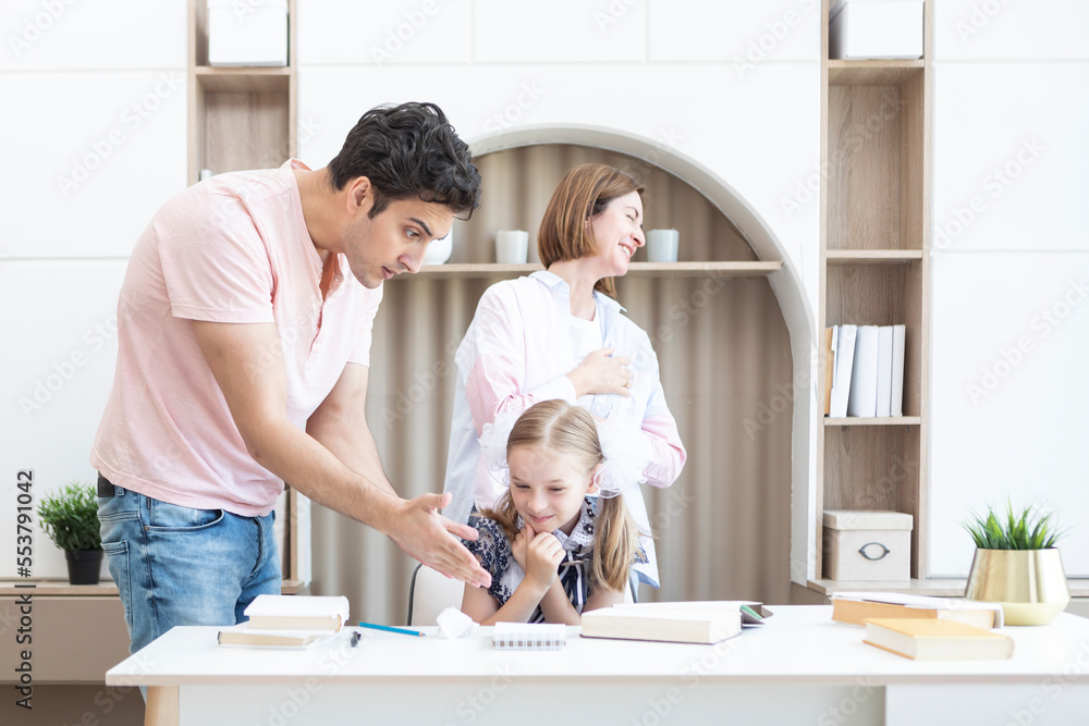 Young parents help their daughter with her lessons, but girl hate education and learning something Young parents help their daughter with her lessons, but girl hate education and learning something