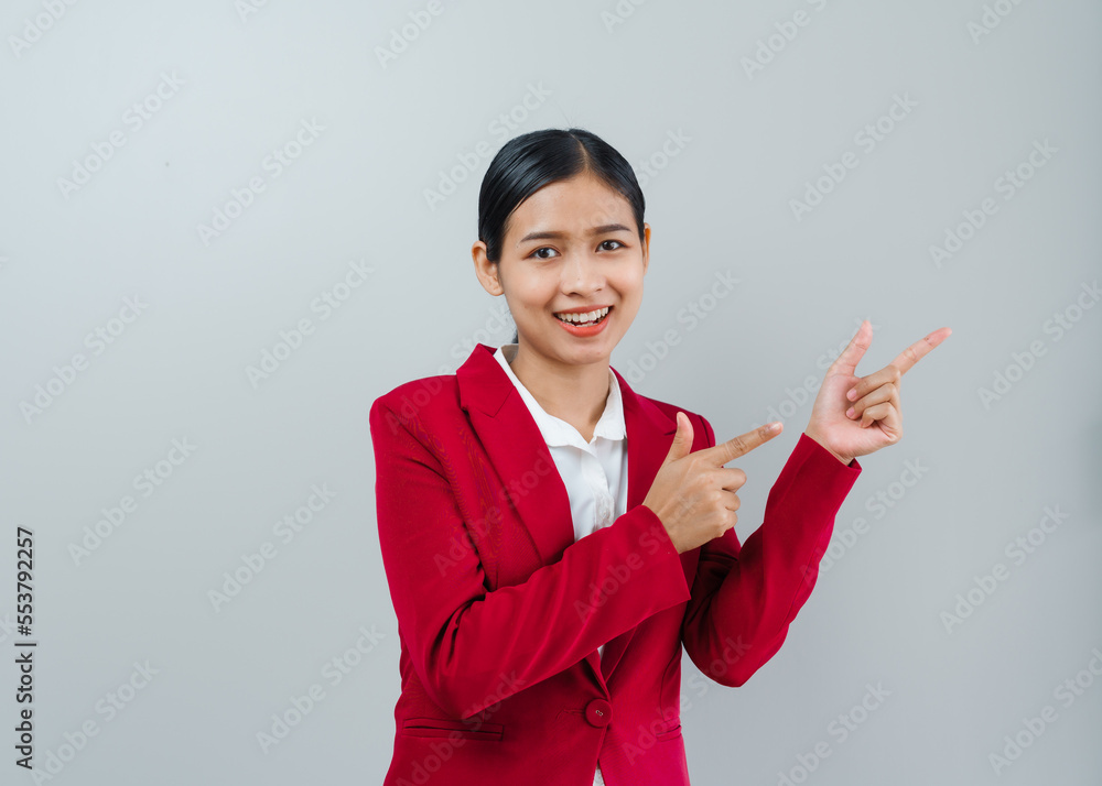 Pretty lovely manager lady successful business asian women in red suit isolated over background. Pointing hands Pretty lovely manager lady successful business asian women in red suit isolated over background. Pointing hands