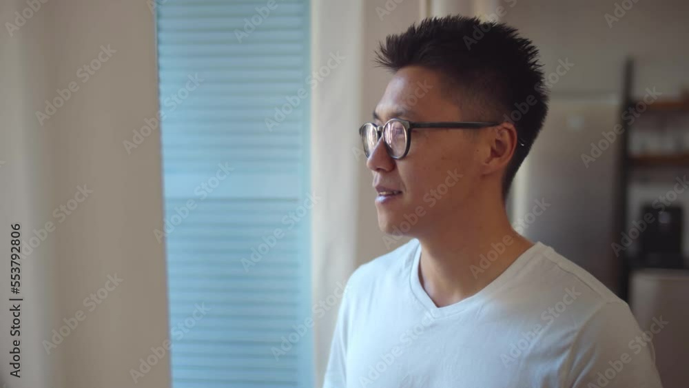 Happy asian man stand near window in morning. Realtime Happy asian man stand near window in morning. Realtime