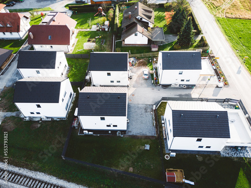 Aerial view of six modern houses on a small lot, somewhre in the countryside  photo