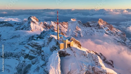 Aerial View of the Mountain Santis in the Swiss Alps, Switzerland. Seantis Weather Station, View Platform at sunset. photo