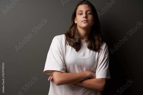 Fotografija Closeup portrait of casual natural girl wearing white t-shirt looking confident
