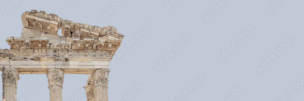 The Temple of Trajan in Pergamon Ancient City. Close up fragment of the entablature. Corinthian order. Isolated, banner, solid color background. History, art or architecture concept. Bergama, Turkey