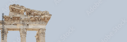 The Temple of Trajan in Pergamon Ancient City. Close up fragment of the entablature. Corinthian order. Isolated, banner, solid color background. History, art or architecture concept. Bergama, Turkey