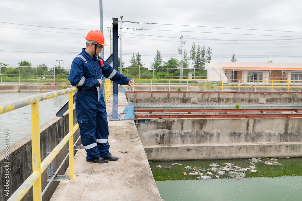 Water plant maintenance technicians, mechanical engineers check the control system at the water treatment plant. Water plant maintenance technicians, mechanical engineers check the control system at the water treatment plant.