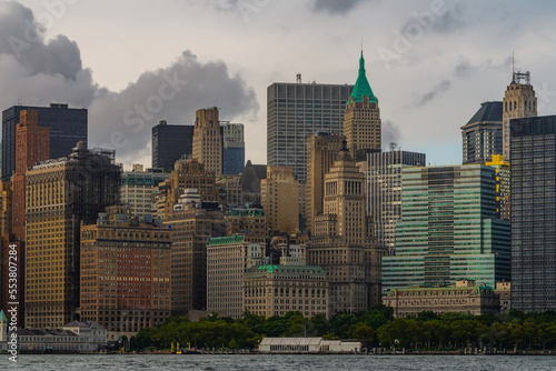 The financial district in lower Manhattan in New York City with clouds in background.