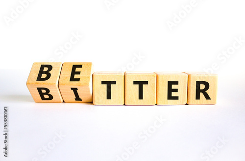 Better or bitter symbol. Concept word Better and Bitter on wooden cubes. Beautiful white table white background. Business and better or bitter concept. Copy space. photo