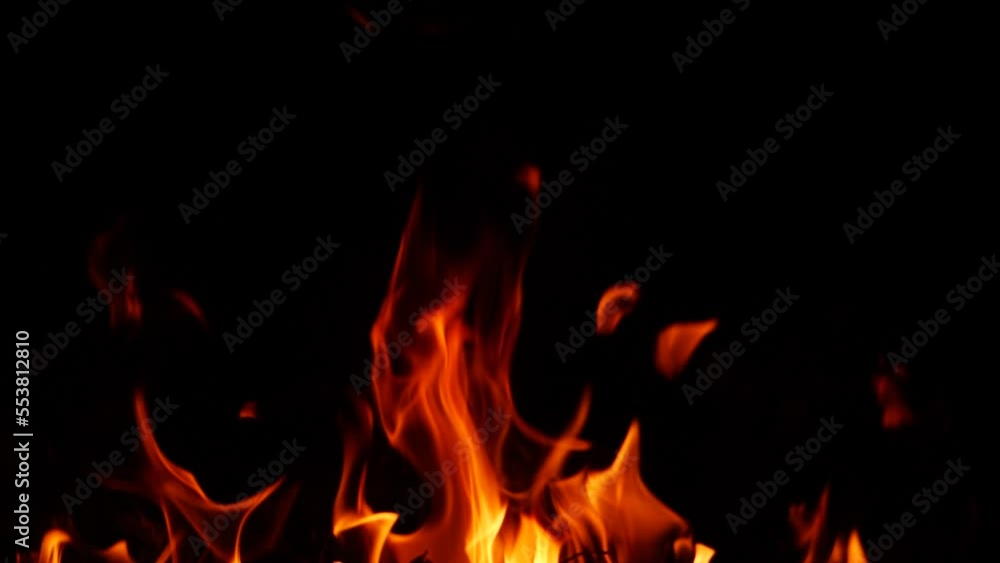 Red and yellow flame from burning fire in darkness Red and yellow flame from burning fire in darkness