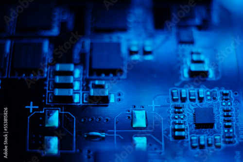 Blue circuit board with various processors and links.