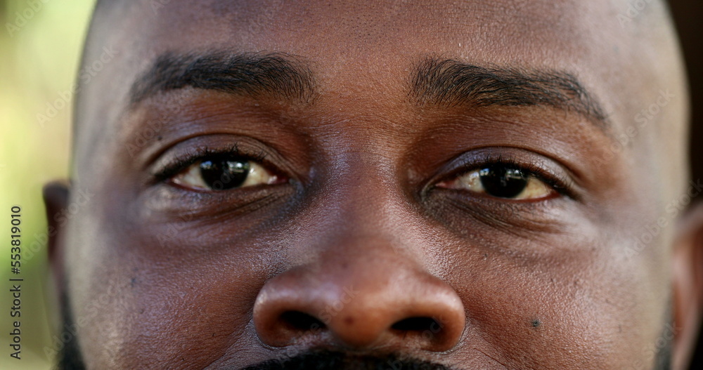 Macro eyes staring at camera, black african ethnicity Macro eyes staring at camera, black african ethnicity