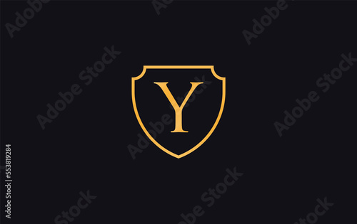 Shield protection symbol and royal luxury shield monogram design. shield protection logo with letters Y