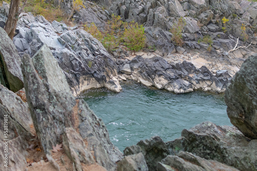 The rocky terrain and rushing rapids of Great Falls Park in Virginia as seen on a cloudy day. © Pábitel Photography