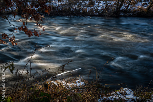 Fast flowing Malse river in winter cold day near Ceske Budejovice city