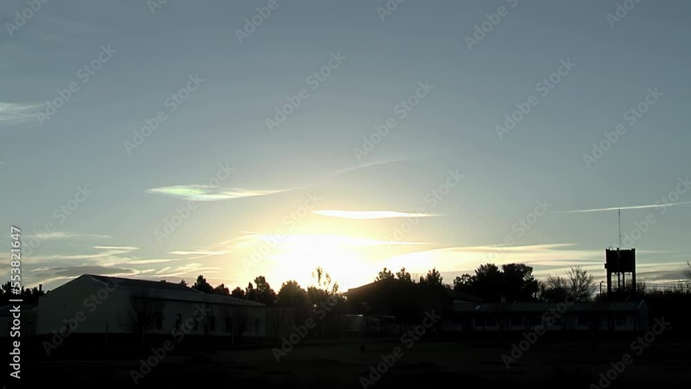 Silhouette of a Farm and Trees at Sunset. 4K Resolution. Silhouette of a Farm and Trees at Sunset. 4K Resolution.