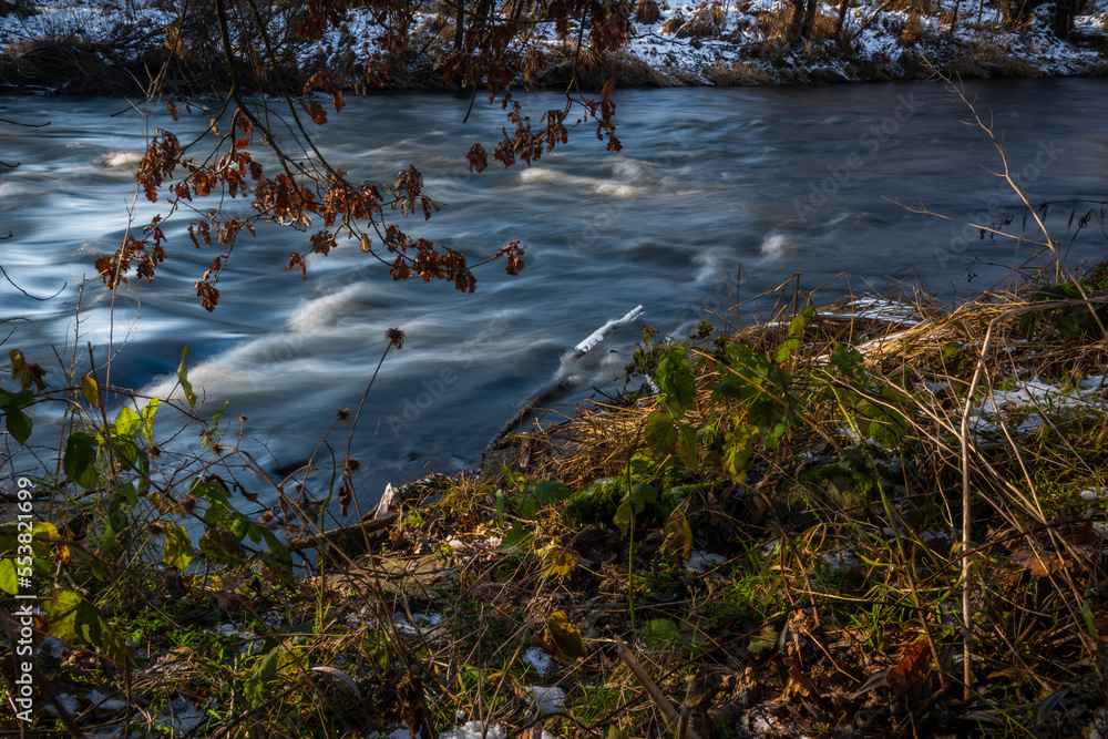 Fast flowing Malse river in winter cold day near Ceske Budejovice city Fast flowing Malse river in winter cold day near Ceske Budejovice city