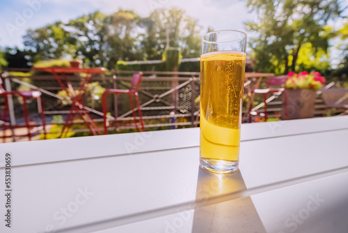 Freshly brewed malt crafted kolsch beer in outdoor bar or german biergarten. Leisure drinks and beverage concept photo