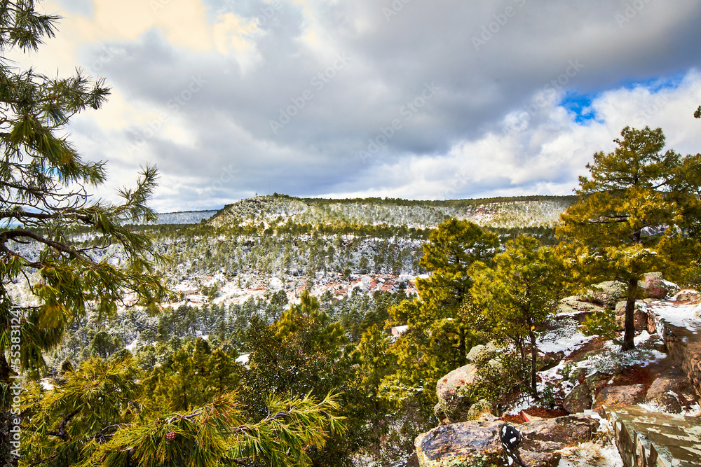 winter landscape with mountains covered of snow and pine trees in creel chihuahua 
