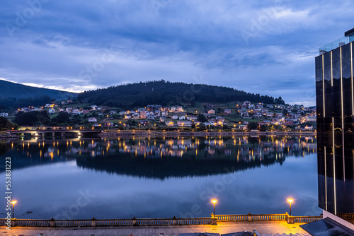 Nightview of Viveiro with river and dwelling houses. Lugo, Galicia, Spain photo