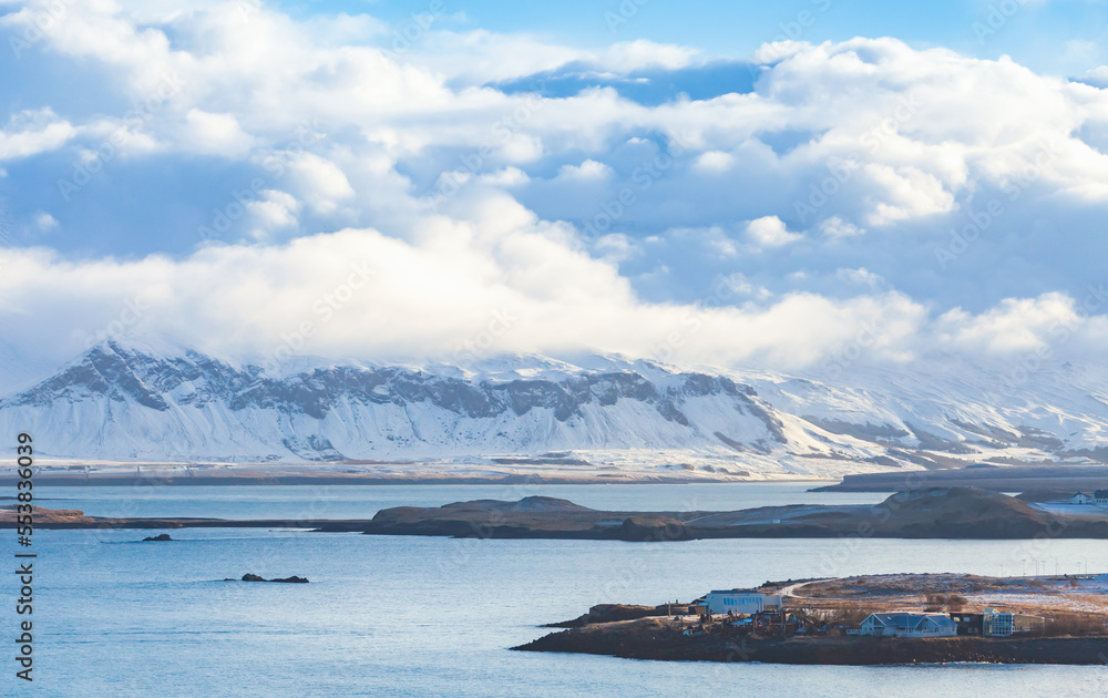 Landscape photo of Reykjavik bay with snowy coastal mountains Landscape photo of Reykjavik bay with snowy coastal mountains