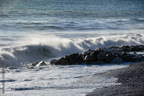 Mediterranean Sea waves rolling ashore on the beach in Nice, France