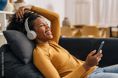 Mixed race woman enjoys the song