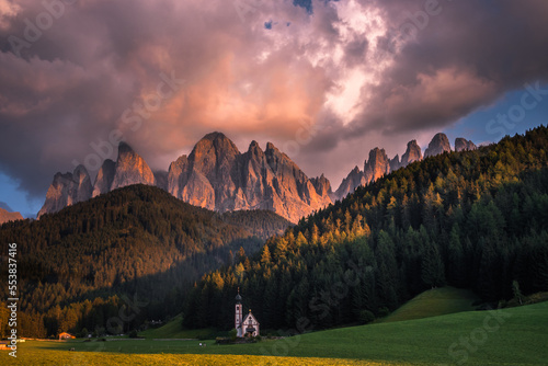 Clouds over the Odle massif in the Dolomites during sunset