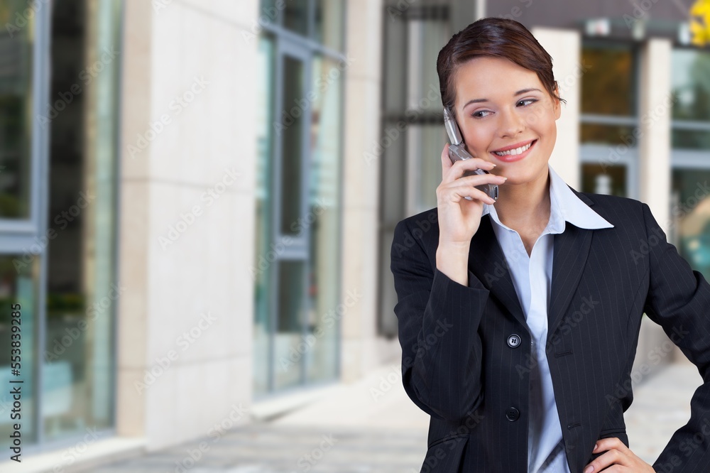 Smiling happy young woman standing outdoor Smiling happy young woman standing outdoor