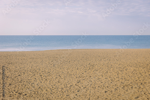 Calm natural background  sea sand and sky in dusty morning
