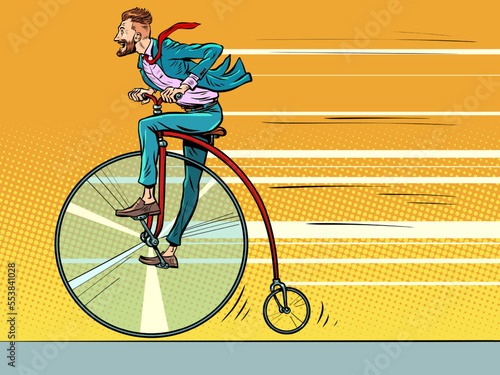 Penny-farthing retro bike, big wheel. Businessman rides forward fast, progress
