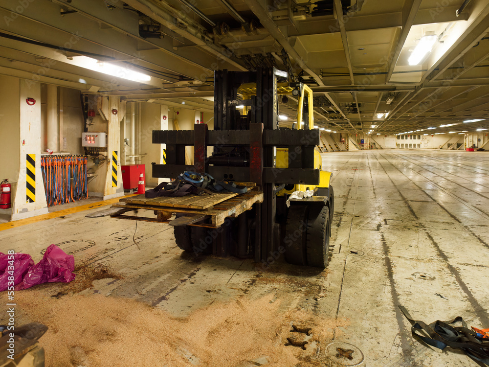Fototapeta premium two tons fork lift inside a big roro ship