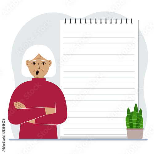 A old woman next to a large notepad or large notebook. The concept of filling a notebook or notepad, writing notes, time management, planning.