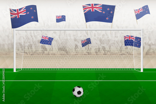 New Zealand football team fans with flags of New Zealand cheering on stadium, penalty kick concept in a soccer match.