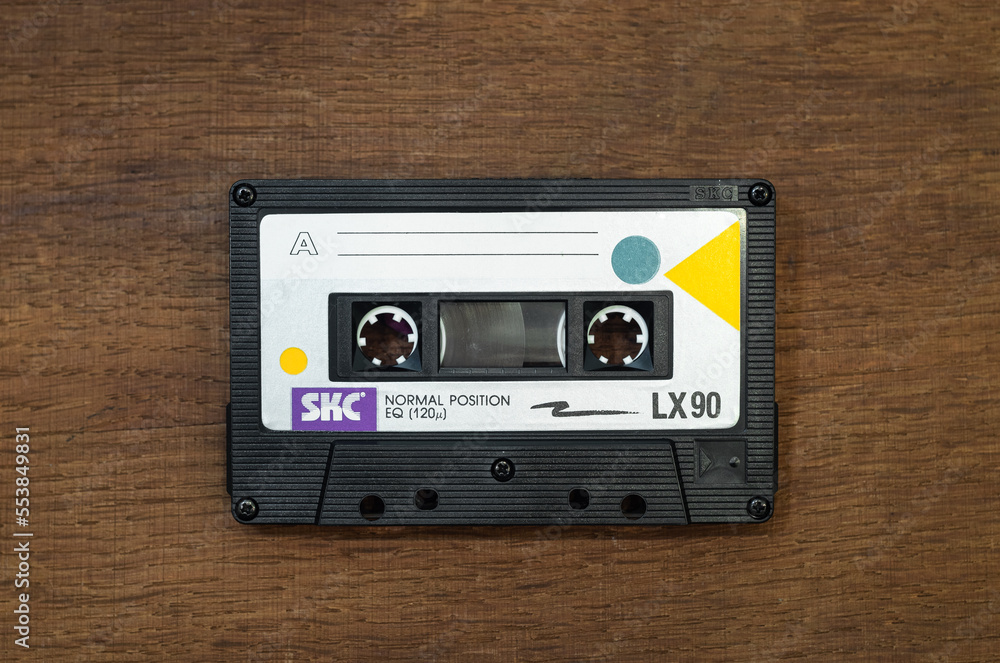 SKC lx90 audio cassette on a wooden table.A tape recorder for listening to  music. A