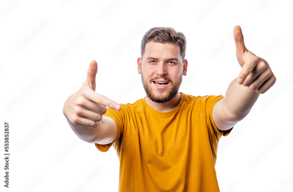 Young handsome caucasian man in yellow t-shirt making yeah-gesture isolated on white background Young handsome caucasian man in yellow t-shirt making yeah-gesture isolated on white background