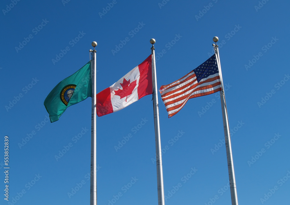 United States Canada And Washington State Flag Blue sky United States Canada And Washington State Flag Blue sky