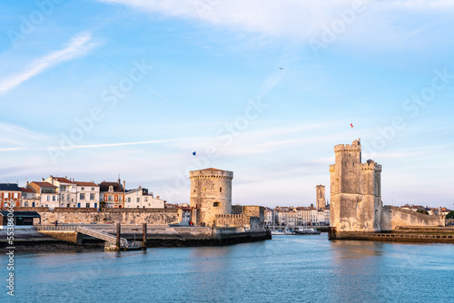 The port of La Rochelle during the blue hour. Panorama of the skyline with its famous towers. banner with copy space