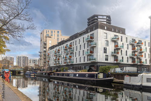 London, UK - July 17, 2016. The Regent's Canal runs through an area of ongoing regeneration with new apartment buildings