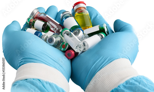 Hand of a Researcher holding Coronavirus COVID-19 Vaccines. photo