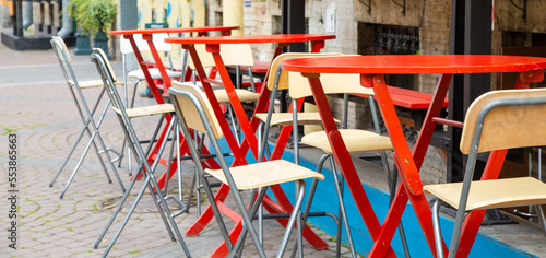Summer cafe with red tables