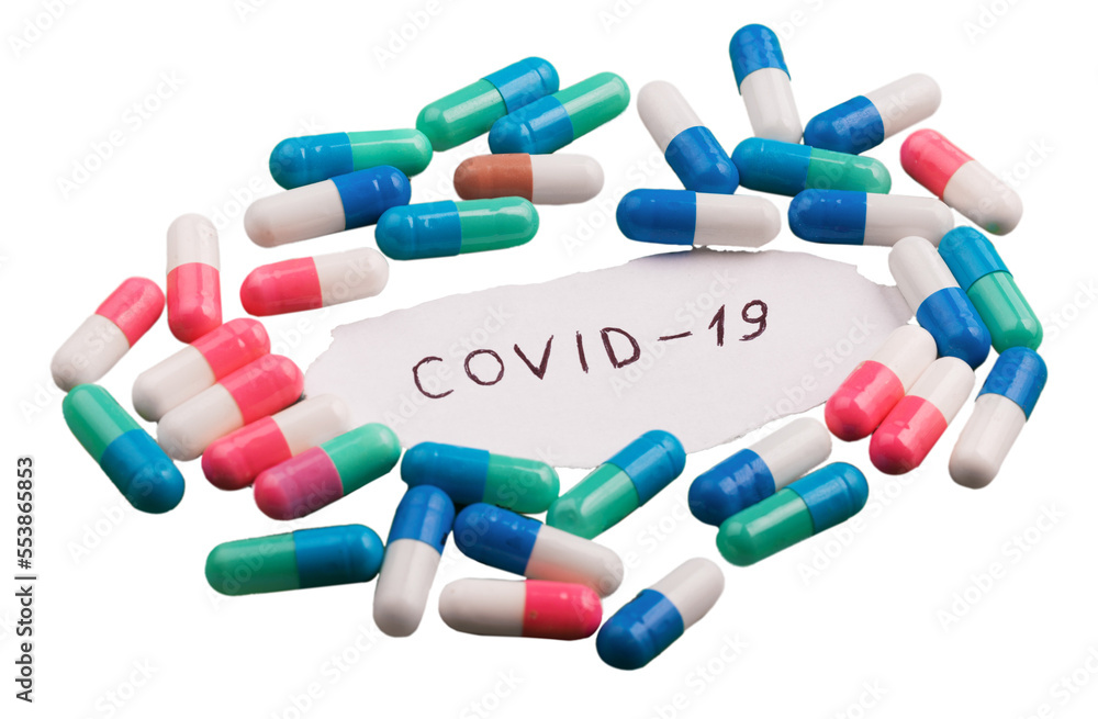Coronavirus disease named covid 19 handwriting on paper with pill Coronavirus disease named covid 19 handwriting on paper with pill