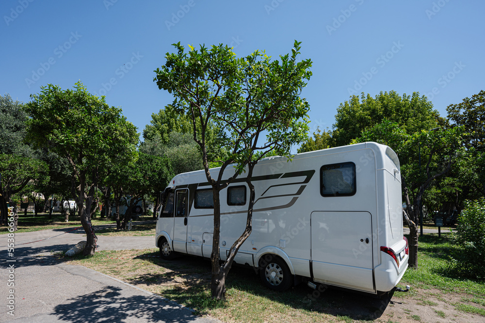 Travel RV parking at park,  holiday trip in motorhome, caravan car on vacation.