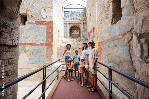 Photography Family tourist posed at Pompeii ancient city, Italy.
