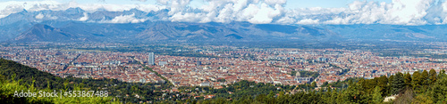 Aerial panorama of the historic center of Turin (Piedmont, Italy) seen from Colle della Maddalena with Alps on the background